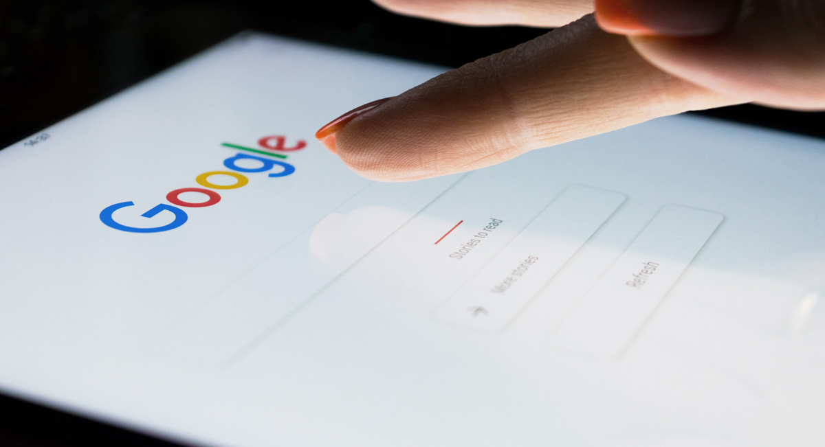 finger tapping on phone with google SEO