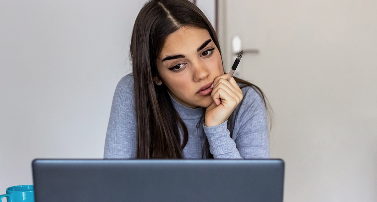 woman sat at laptop common mistakes made with ranking google keyword