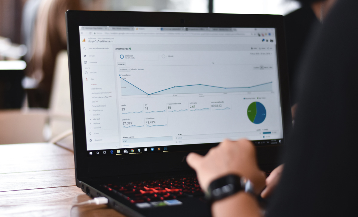 man on laptop identifying gaps and opportunities in SEO for dental strategy