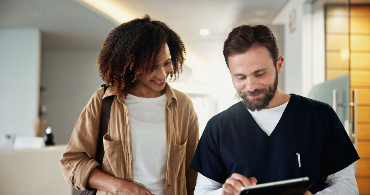 woman at dental reception digital dental marketing and patient acquisition