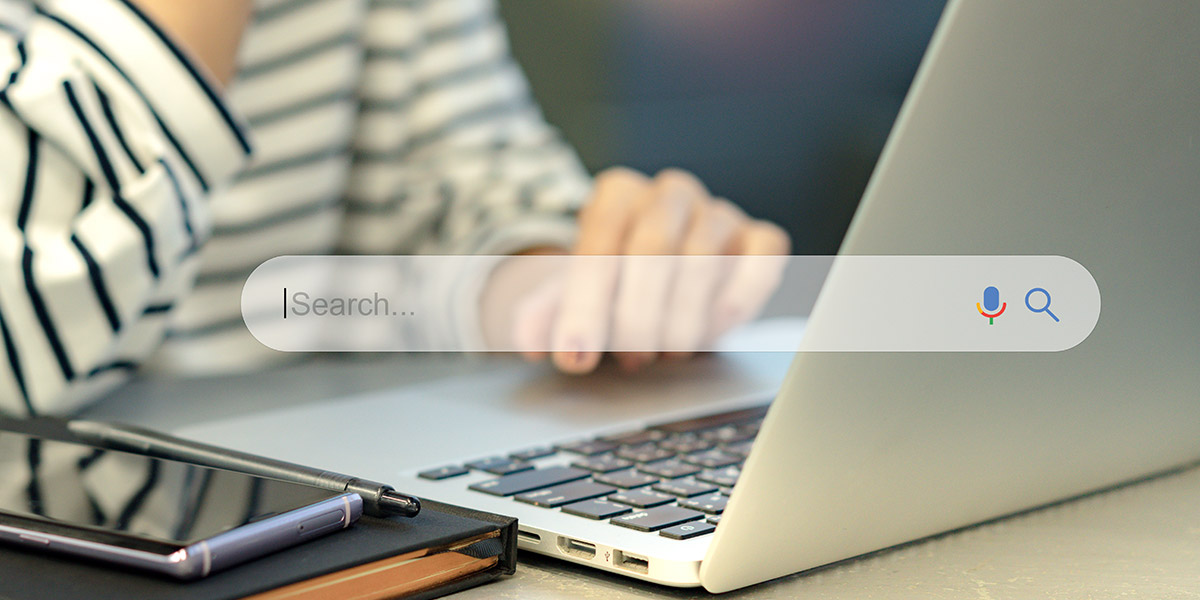 Woman on laptop dental website redesign SEO