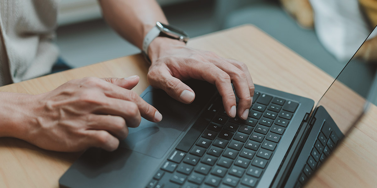 man searching on laptop and how patients find dentists online