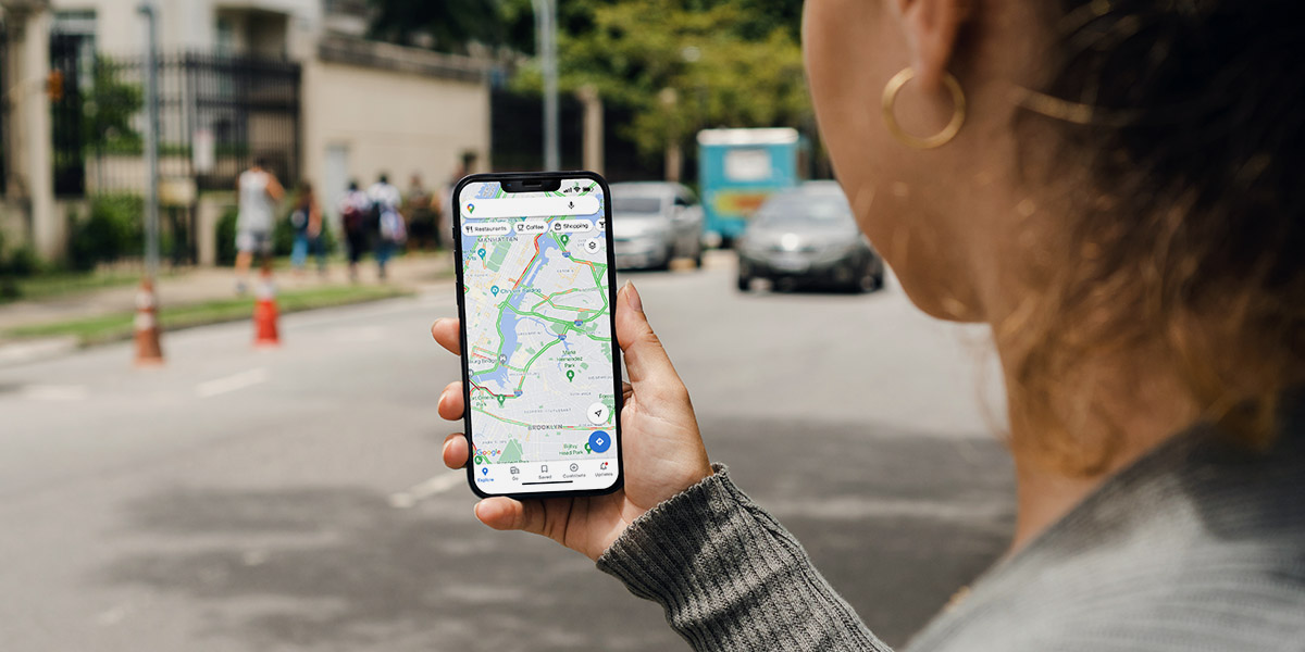woman walking with google maps ranking factors for dentists
